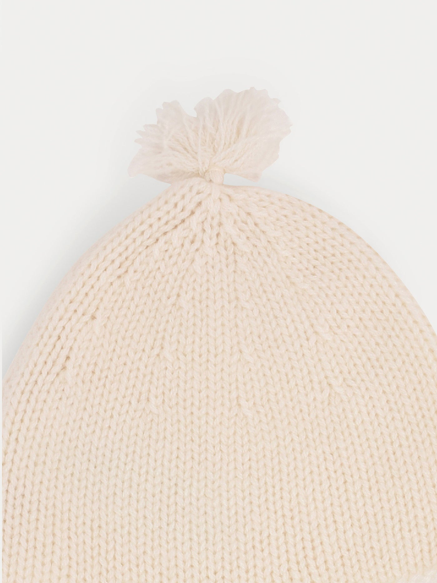 Bonnet bébé blanc lait en cachemire avec pompons